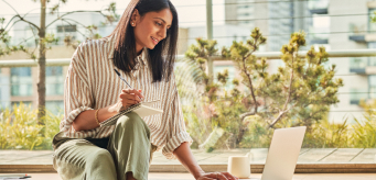 photo of a person examining data on a laptop