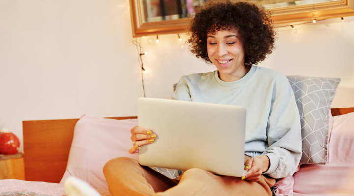 photo of someone watching video on their laptop
