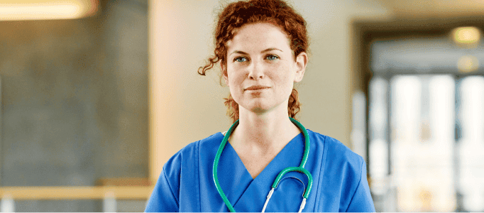 Image of a healthcare professional in scrubs.