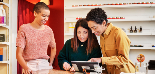 Three individuals huddled together.