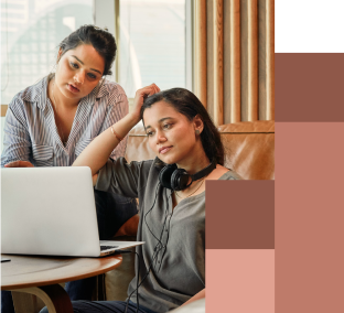 Image of two people looking at a computer screen