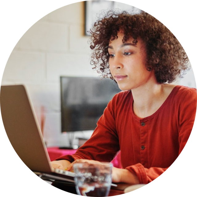 Photo of a person working on a laptop